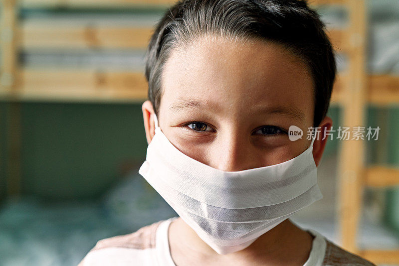 6-7 years old cute child wearing surgical mask.